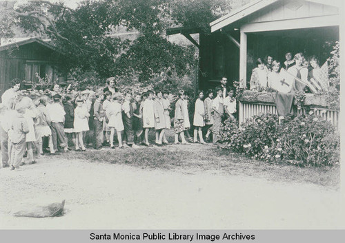 Sunday school children gathered outside Charles Scott's cottage (to the right) in Temescal Canyon, Calif