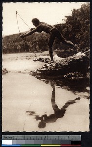 Indigenous man fishing with a bow, Solomon Islands, ca.1900-1930