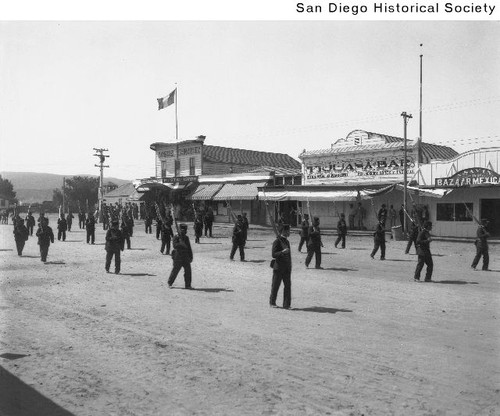 Mexican soldiers marching up Main Street in Tijuana, Mexico