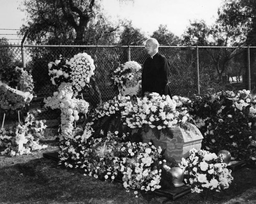 Burial with white chrysanthemums