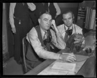 Al Horton and Leo McDonald with the wandering possum, Los Angeles, 1936