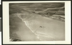 Aerial view of flooding of the Santa Ana River, showing breaks in levees near Santa Ana, ca.1930