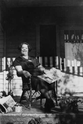 Woman sitting on porch