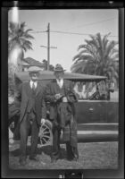 H. H. West and Abraham Whitaker stand beside a car at West't house, Los Angeles, about 1929