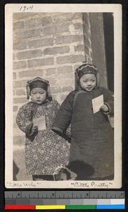 Girls standing outside a building, China, ca.1904