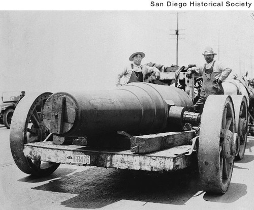 Two men overseeing the transporting of a cannon to Fort Rosecrans on a horse-drawn wagon