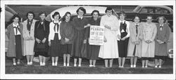 Camp Fire girls holding a sign for peanut sales, Petaluma, California, 1956