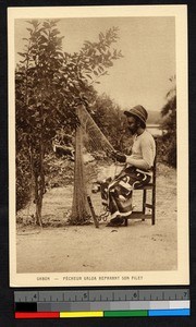 Fisherman mending his nets, Gabon, ca.1920-1940