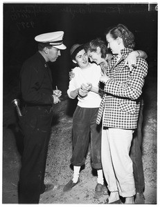 Girls rescued from cliff at Pacific Palisades by firemen, 1951