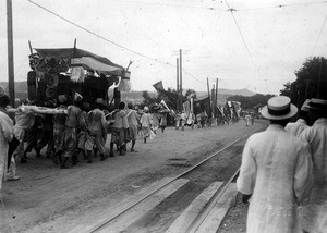 Funeral procession beside railroad tracks in Korea