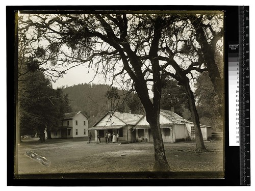 Scene at Hoopa Valley [Small group on porch of one of the Reservation buildings]