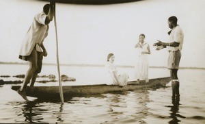In a dugout on the river, the missionaries Graziella Jalla and Hélène Roser