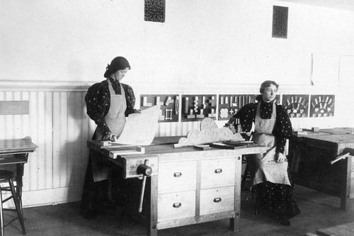 Two female students in woodshop class