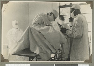 Dr Irvine operating on a patient, Chogoria, Kenya, ca.1946