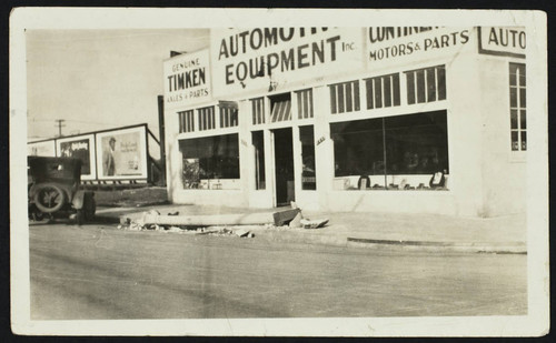 Automotive equipment store with fallen street light, damage from the 1933 earthquake