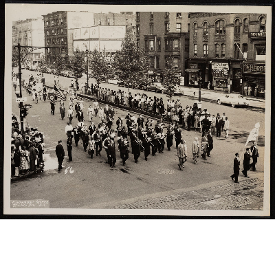 Marching band and Negro Labor Committee marching in parade