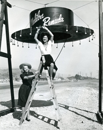 Publicity photo with the Malibu Remuda giant hat entrance sign, 1947