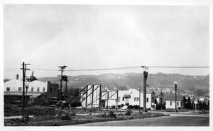 Looking northwesterly through southwest corner of Melrose and Westbourne Avenues, showing signs which were reported as obstructing vision of traffic, Los Angeles, 1930