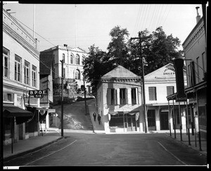 View down North Pine Street in Nevada City, California, showing Jackson's Grocery on Commercial Street, ca.1935-1936
