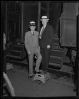 Heber J. Grant and J. Reuben Clark, Mormons, at train station, 1935