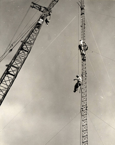 Workers repairing antenna, Pomona College