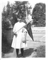 Mary Louise McChristian, about 1914 at about 11 years of age, holding a Sebastopol Apple Show pennant