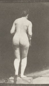 Nude woman ascending a step