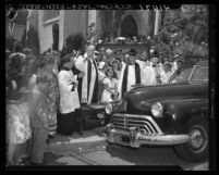 Bishop Ernest Vincent Shayler blessing automobile at St. Thomas Episcopal Church in Los Angeles, Calif., 1946
