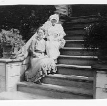 Two Women Seated on Steps