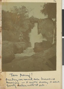 Tarr posing at a waterfall, Maseno, Nyanza province, Kenya, 1918
