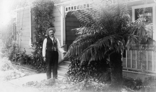 Man in front of a house