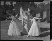 Three members of the California Music Club Juniors - Shirley Smith, Elizabeth Hunt and Virginia Solomon - in a rehearsal for a holiday play, Los Angeles, 1935