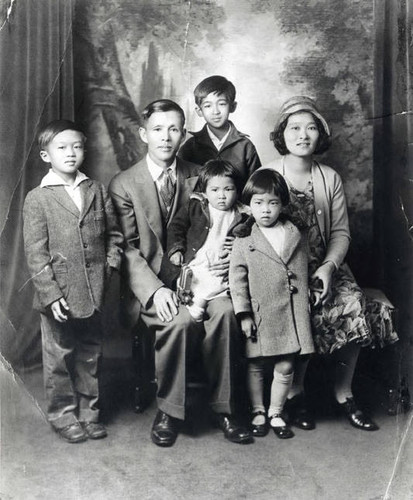 Kwok family portrait: Andrew, Wai Shing (father), John (back row), Alice (on lap), Sarah and Ko Po (mother)