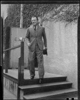 Man walking down steps from doorway, 1927 or 1937