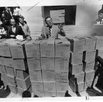 Howard Jarvis, businessman, lobbyist and anti-tax advocate behind Proposition 13, shown here with boxes of letters supporting Prop 13 at a Capitol news conference