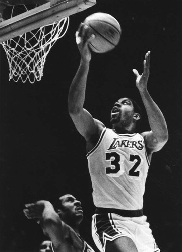 Magic Johnson about to score against Suns during Western Conference Finals