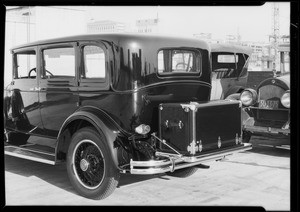 Rear view Packard automobile and trunk, Southern California, 1929