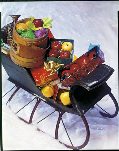 Sleigh with Christmas presents and apples