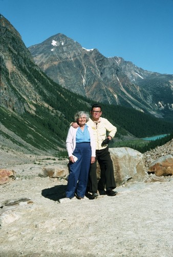Carl L. Hubbs and Laura C. Hubbs looking northwest from moraine of Mt. Edith Savell Glacier, Lake Cavelle in distance, Alberta, Canada