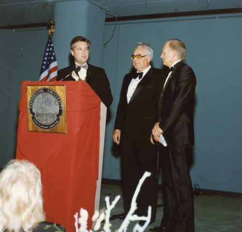 President Davenport and Dean Wilburn making a presentation to Herbert Boeckmann II