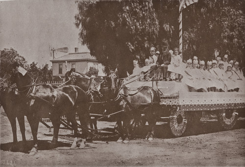 B. F. Conaway photograph of children on a wagon, part of a 4th of July celebration