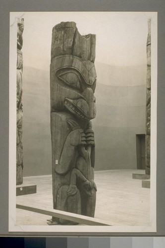 A little totem pole in Indian exhibit - Federal building - this type used as corner posts for houses - so the sign near it said