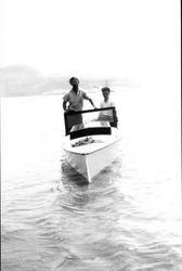 Jesse Lapham and Dick Beedle in motor boat built by Jesse Lapham
