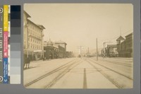 [Street scene, with horse buggies, electric trolley car, automobiles and approaching train. Shattuck Avenue, Berkeley?]