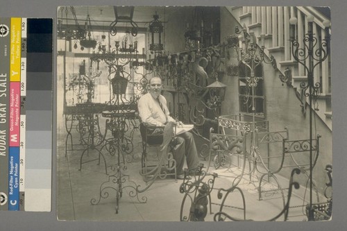 [Unidentified man. Interior of store. Liberty Ornamental Iron & Wire Works Inc.?]