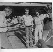Joe Hitch photographs his son, Bob, and wife, Eve, prior to their solo flights from Phoenix Field in Fair Oaks