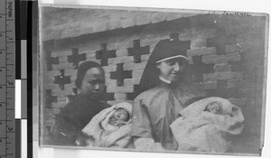 Maryknoll Sister with woman and two infant orphans, Yeung Kong, China, ca. 1930