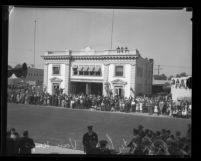 Van Nuys City Hall dedication: crowd lining street outside old city hall [Engine Co. No. 39], 1933