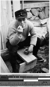 Carpenter smoking a pipe, Japan, ca. 1937