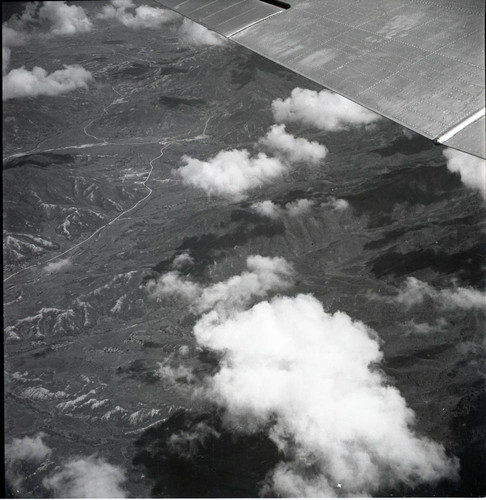 Aerial photograph of clouds and mountains